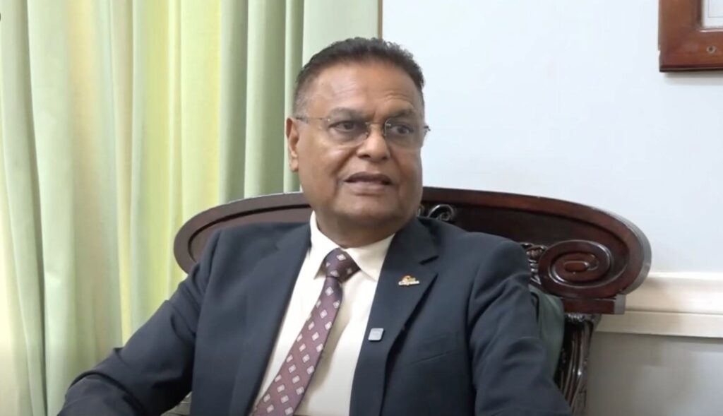 Speaker Manzoor Nadir seated during an interview on parliamentary sittings