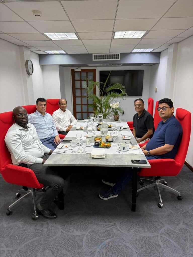 Regional parliamentary representatives seated together during a meeting over lunch